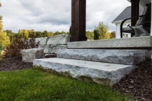 marble looking stone staircase with grass